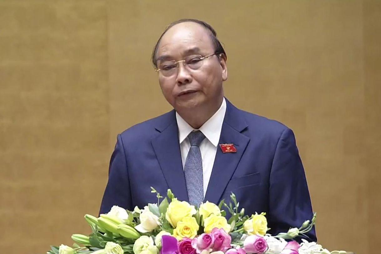 Tại phiên khai mạc, Thủ tướng Chính phủ Nguyễn Xuân Phúc trình bày Báo cáo về phòng, chống dịch Covid-19 và những nhiệm vụ, giải pháp trọng tâm phục hồi, phát triển kinh tế-xã hội. (Ảnh: TTXVN)