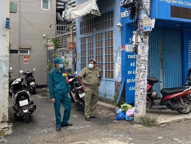 Lực lượng chức năng chốt chặn tại hẻm 415 Nguyễn Văn Công (phường 3, quận Gò Vấp, Thành phố Hồ Chí Minh) nơi có điểm sinh hoạt của giáo phái truyền giáo Phục Hưng. 